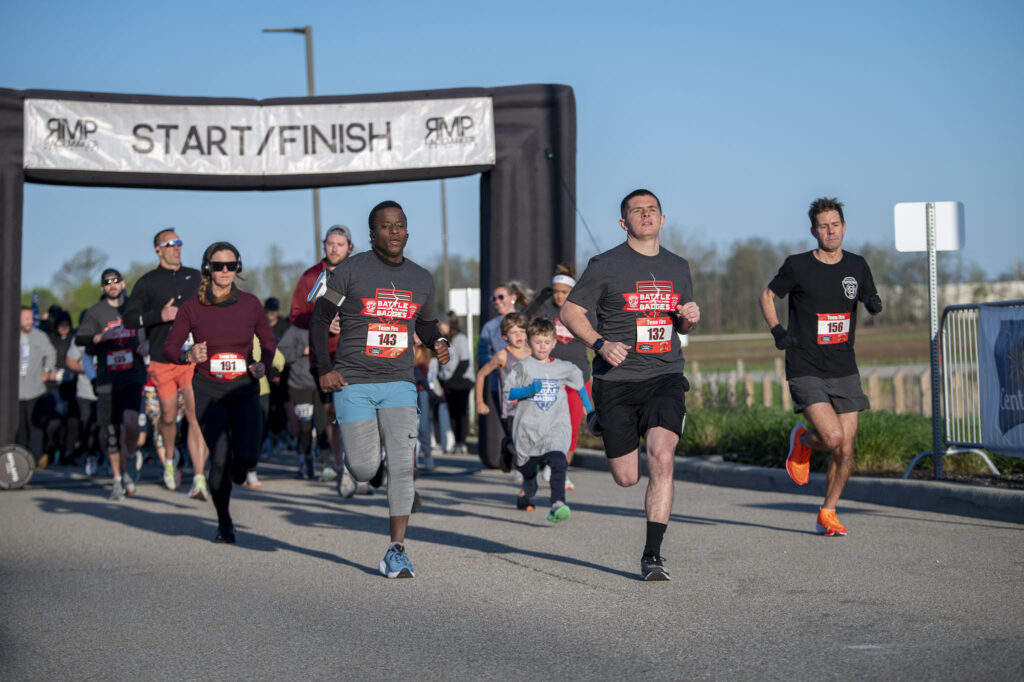 Participants racing for the Battle of the Badges 5K
