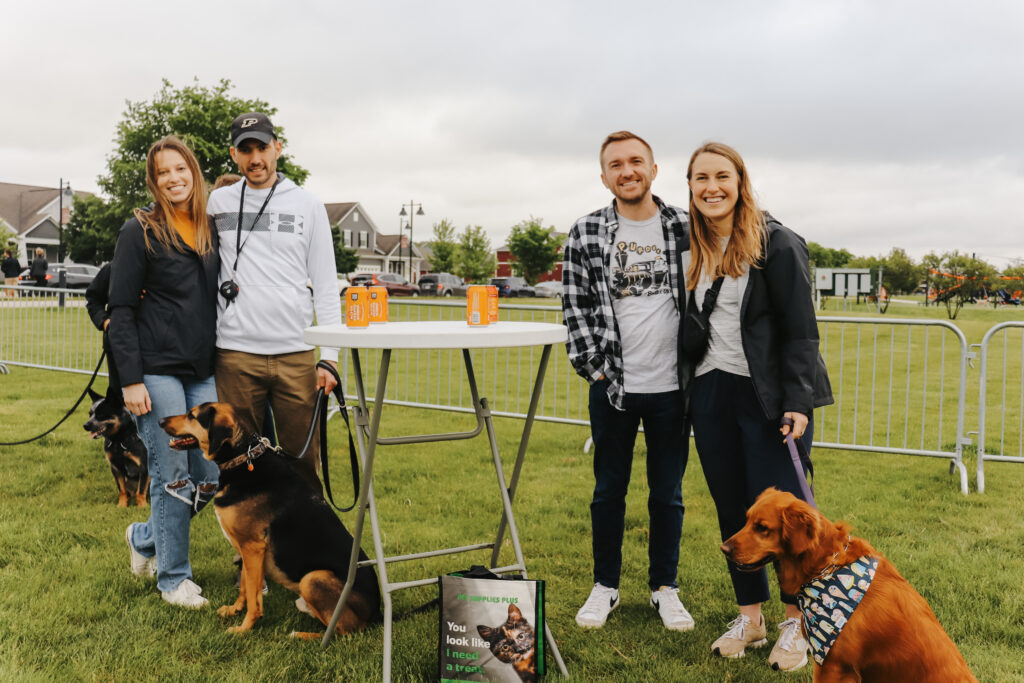 Attendees with their dogs at Hops & Hounds