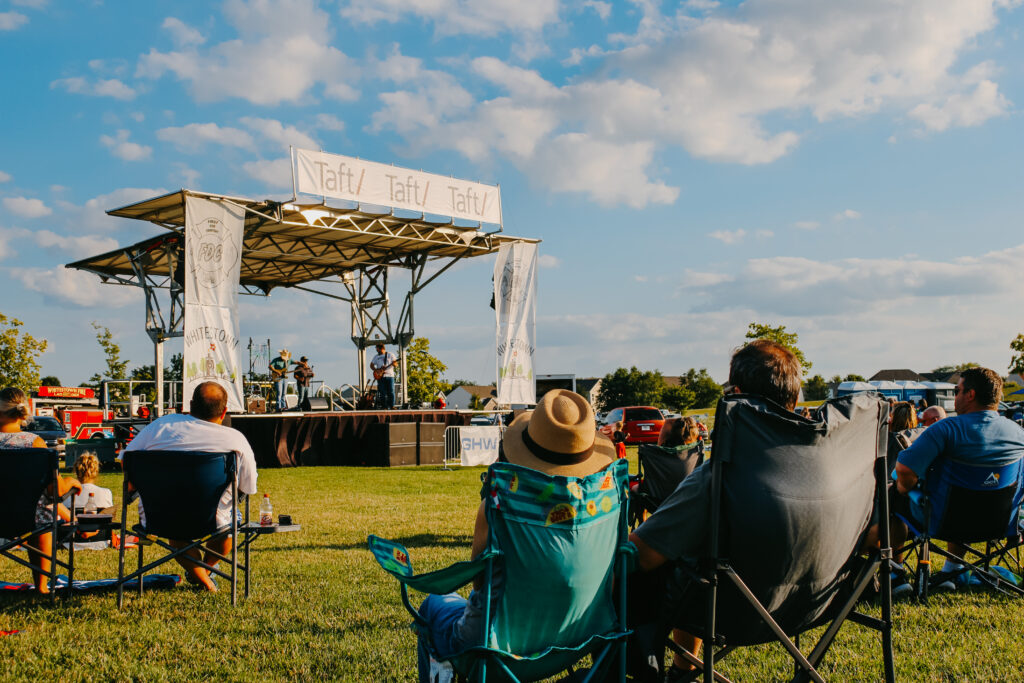 People sitting and listening to music at the Summer Concert Series