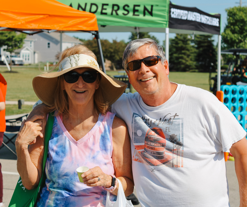 People smiling at the Whitestown Farmers Market